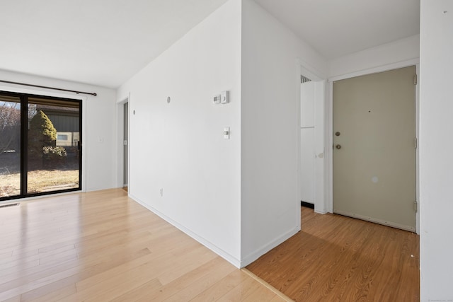 spare room featuring light hardwood / wood-style floors