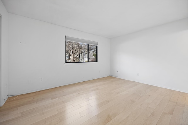 empty room with light hardwood / wood-style floors