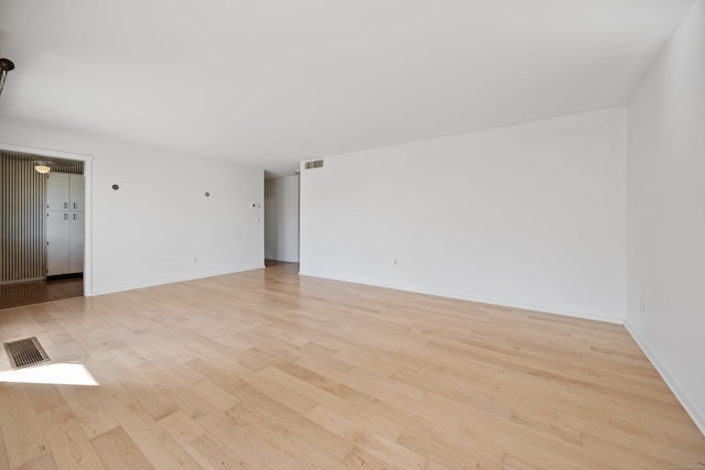 unfurnished room featuring light hardwood / wood-style floors