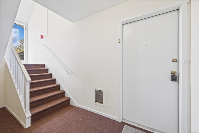 foyer featuring carpet flooring