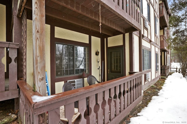 view of snow covered property entrance