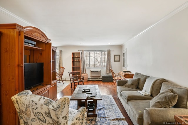 living room featuring crown molding and light hardwood / wood-style floors