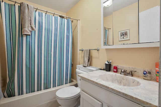 full bathroom featuring vanity, shower / bath combo, and toilet