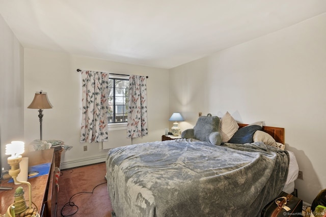 carpeted bedroom featuring a baseboard radiator