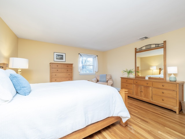 bedroom with light hardwood / wood-style floors