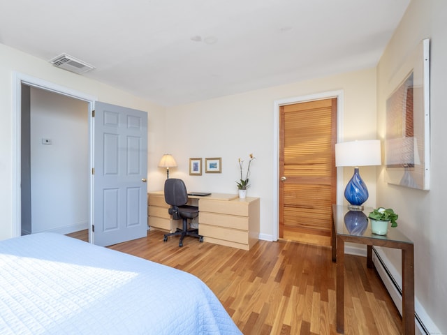 bedroom with hardwood / wood-style floors