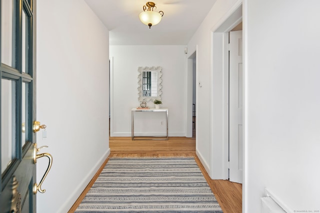 corridor featuring hardwood / wood-style flooring