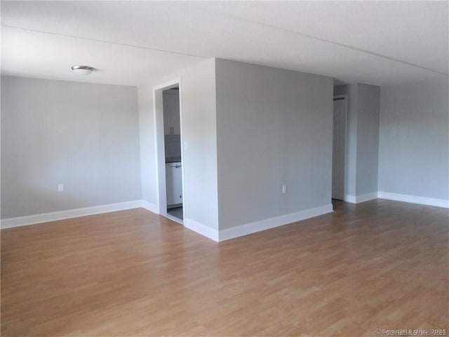 unfurnished room featuring hardwood / wood-style floors