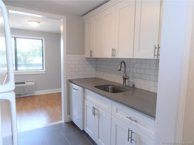 kitchen with white cabinetry, sink, white appliances, and decorative backsplash