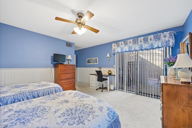 bedroom featuring ceiling fan and light carpet