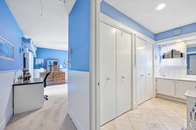 interior space featuring light colored carpet