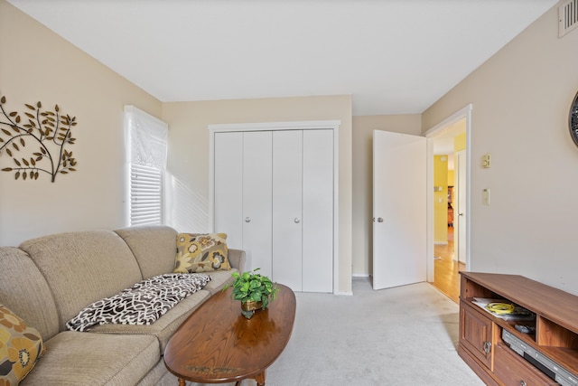 living room with light colored carpet