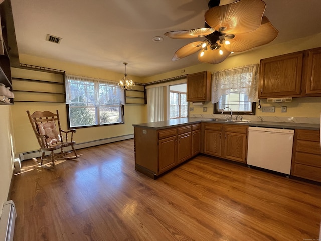 kitchen featuring dishwasher, wood finished floors, baseboard heating, and a baseboard radiator