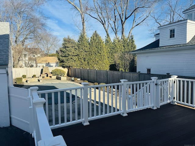 wooden terrace featuring a patio area