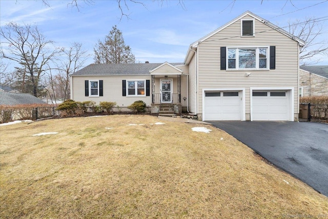 view of front of property featuring a garage and a front yard