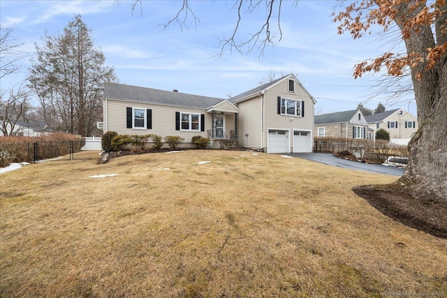 view of front facade with a garage and a front yard