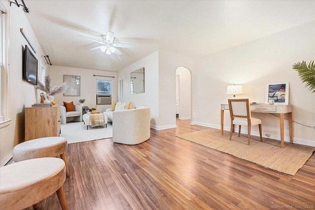 living room featuring cooling unit, ceiling fan, and hardwood / wood-style floors