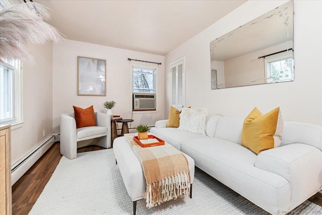 living room with cooling unit, a wealth of natural light, dark hardwood / wood-style flooring, and baseboard heating