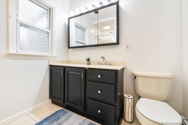 bathroom with tile patterned floors, vanity, and toilet