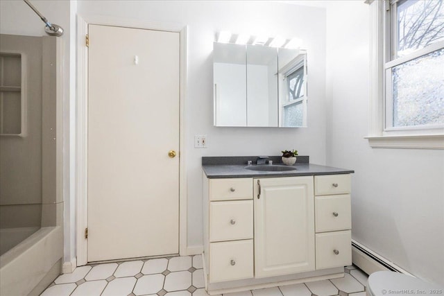 full bathroom featuring vanity, a baseboard radiator,  shower combination, and toilet