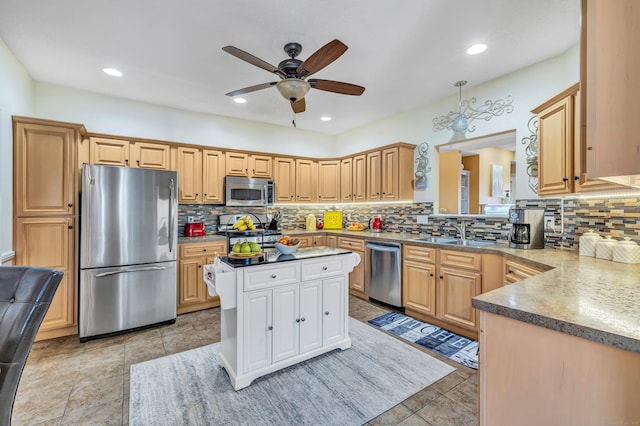 kitchen featuring tasteful backsplash, appliances with stainless steel finishes, sink, and light brown cabinets