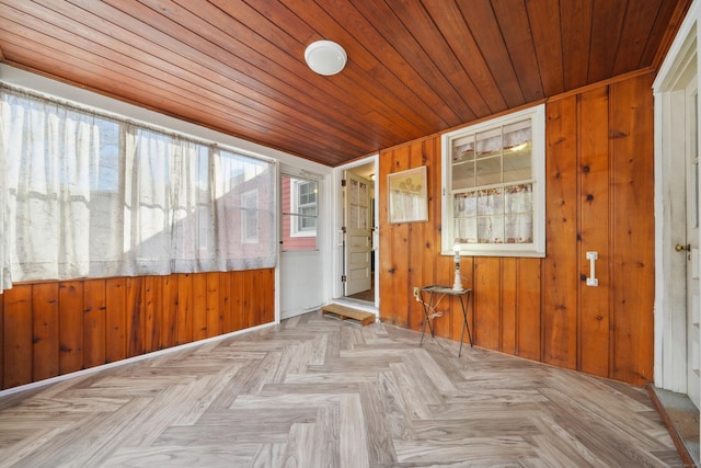 unfurnished sunroom with wooden ceiling