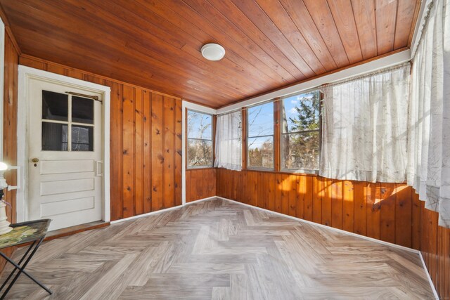 unfurnished sunroom with wooden ceiling