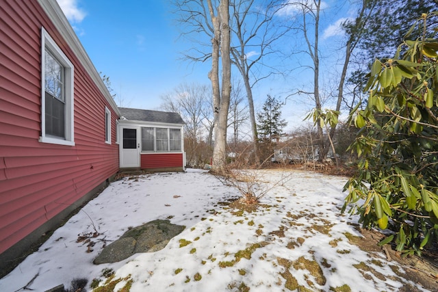 view of yard covered in snow