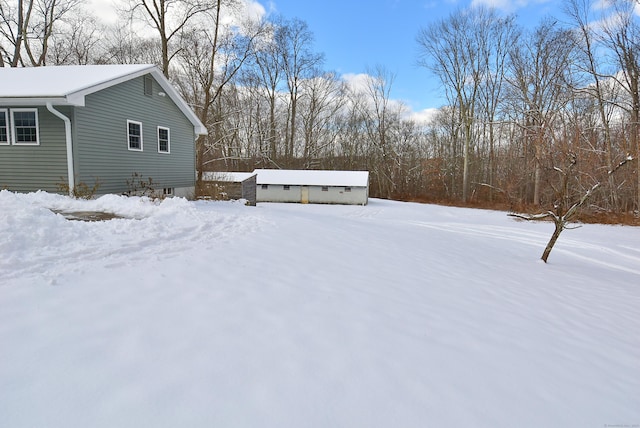 view of yard layered in snow