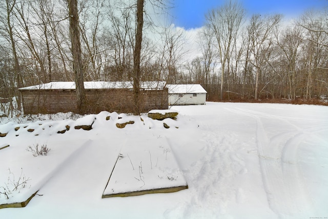 view of yard layered in snow