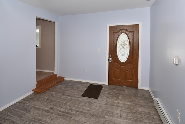 foyer entrance featuring a baseboard radiator