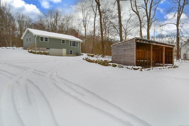 view of yard layered in snow