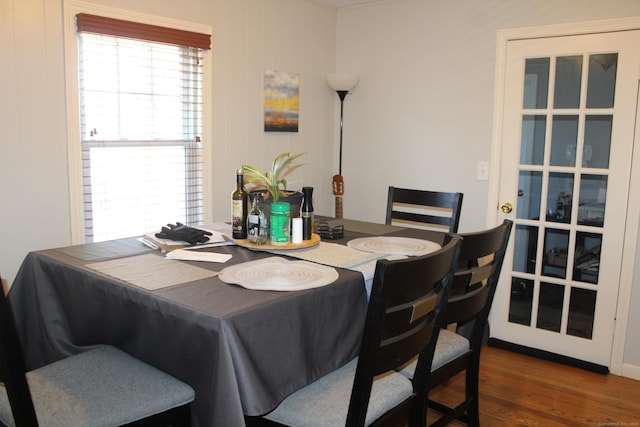 dining space with dark wood-type flooring