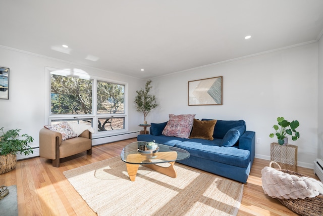 living room featuring hardwood / wood-style flooring, ornamental molding, and a baseboard heating unit