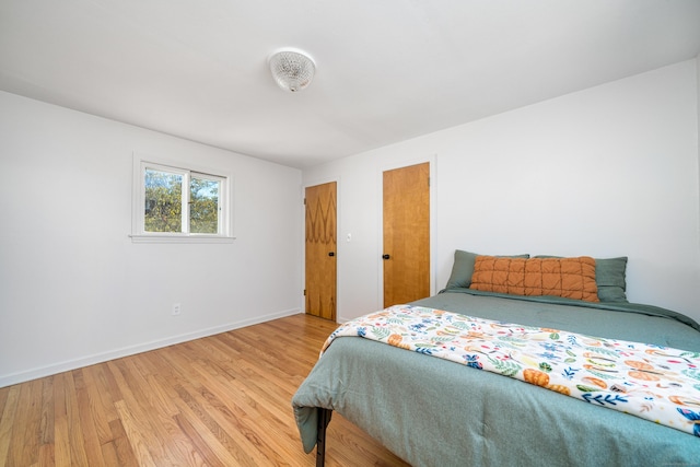 bedroom with light hardwood / wood-style flooring