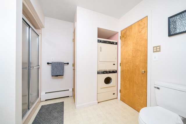 bathroom with walk in shower, stacked washer and clothes dryer, a baseboard heating unit, and toilet