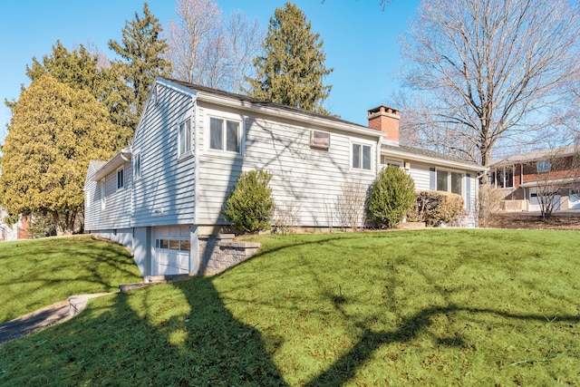 view of home's exterior with a yard