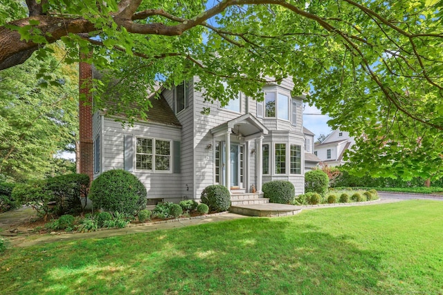 view of front of home with a front yard