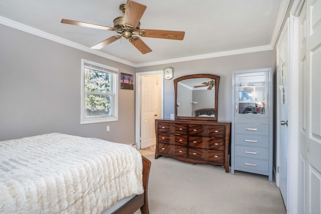 carpeted bedroom with crown molding and ceiling fan