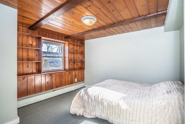 carpeted bedroom with a baseboard heating unit, wooden walls, wood ceiling, and beam ceiling