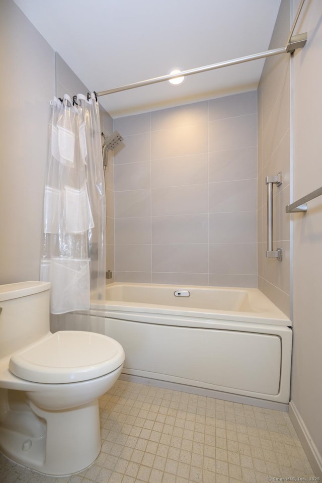 bathroom featuring tile patterned floors, baseboards, toilet, and shower / bath combination with curtain