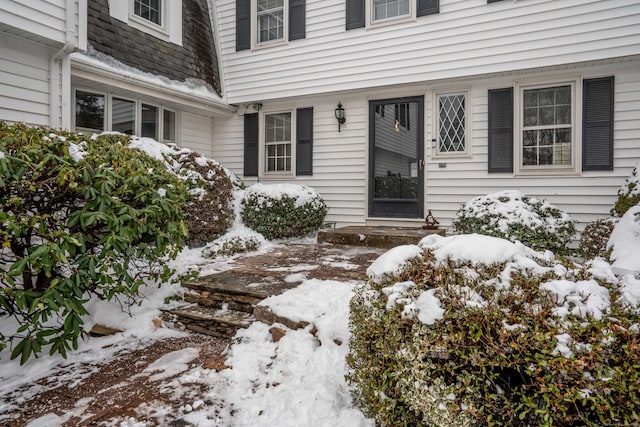 view of snow covered property entrance