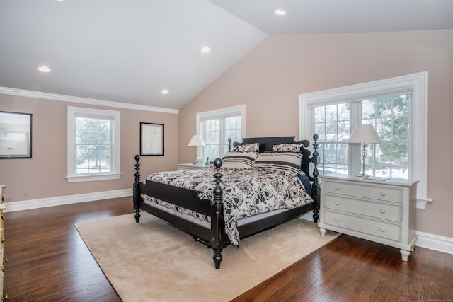 bedroom featuring lofted ceiling, dark hardwood / wood-style floors, and multiple windows