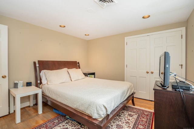 bedroom with a closet and light wood-type flooring