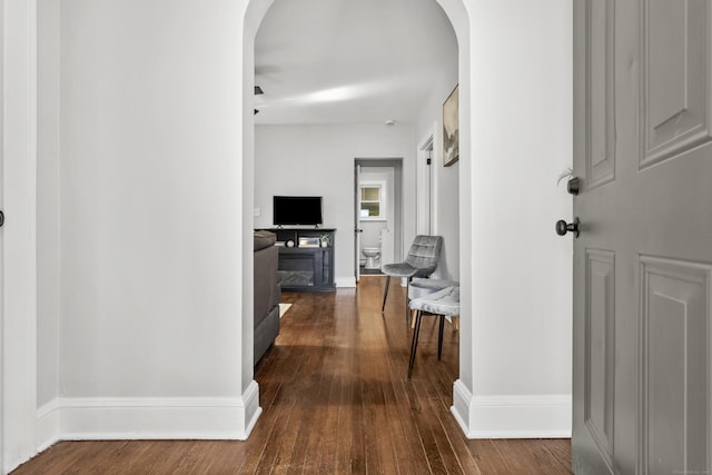 hall with dark wood-type flooring