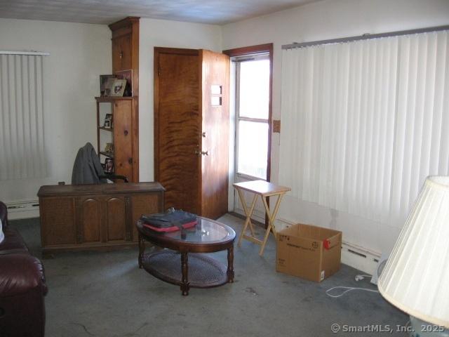 38 New Haven Rd, Seymour, CT 06483 - living area with a baseboard heating unit and carpet