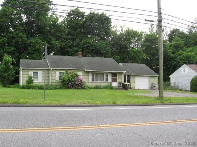 38 New Haven Rd, Seymour, CT 06483 - single story home featuring driveway, an attached garage, a front yard, and view of wooded area