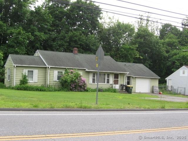 38 New Haven Rd, Seymour, CT 06483 - single story home with a garage, a front yard, driveway, a chimney, and view of scattered trees