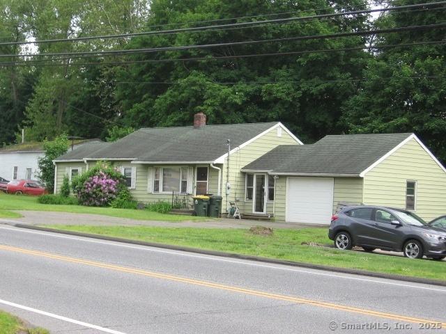 38 New Haven Rd, Seymour, CT 06483 - single story home with a garage, a chimney, asphalt driveway, and a front yard