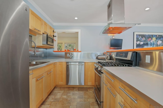 kitchen with appliances with stainless steel finishes, island range hood, light brown cabinetry, sink, and decorative backsplash